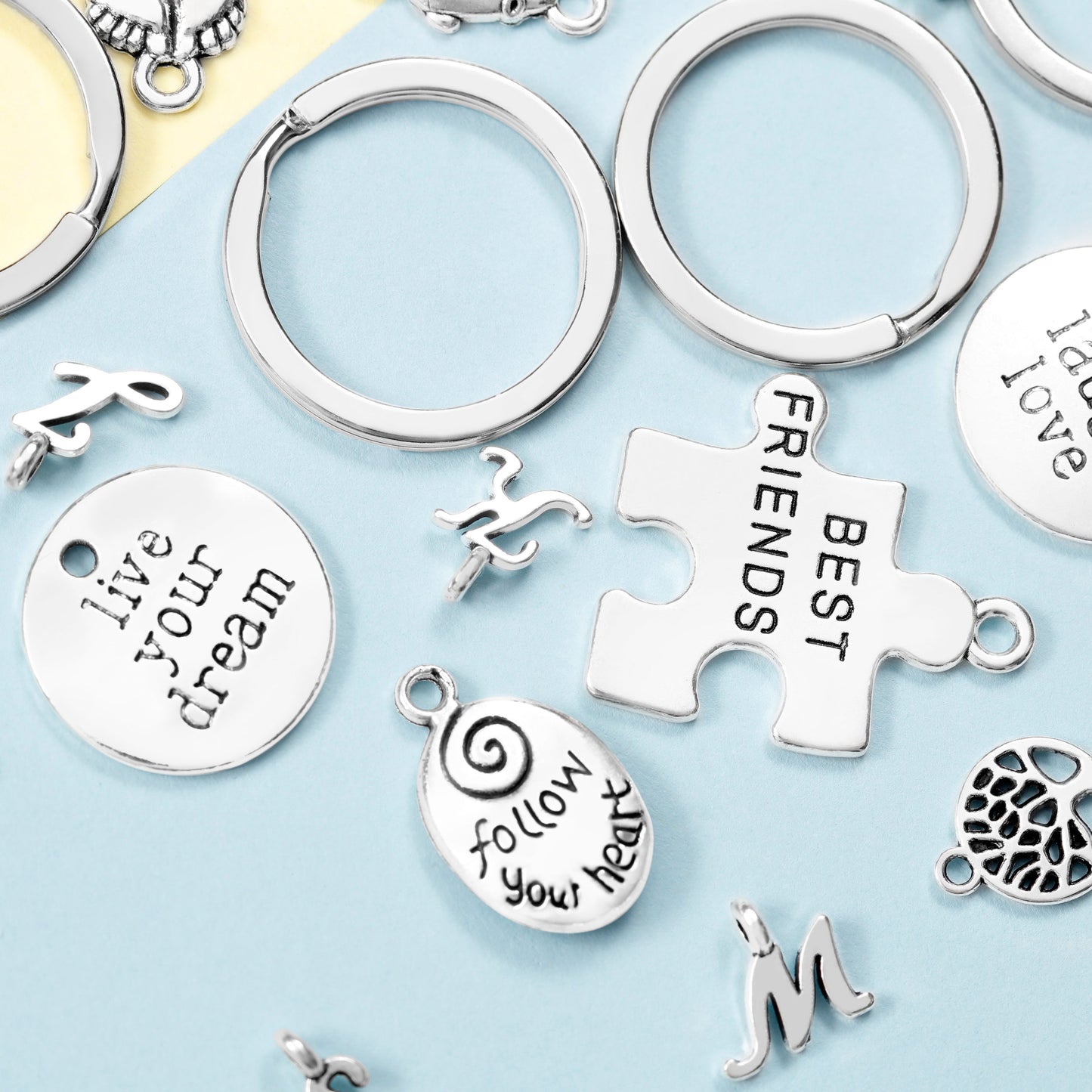 Image of Assorted Silver Charms Close-up | Caption-Assorted Silver Charms Close-up