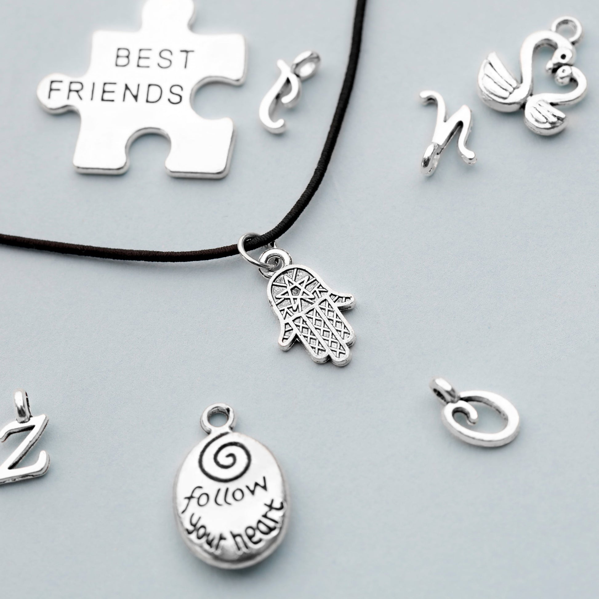 Image of Close-up of Best Friends Charms and Other Designs | Caption-Close-up of Best Friends Charms and Other Designs